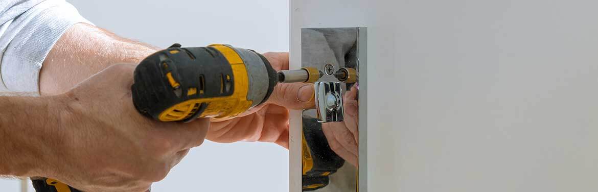 handyman replacing door knob