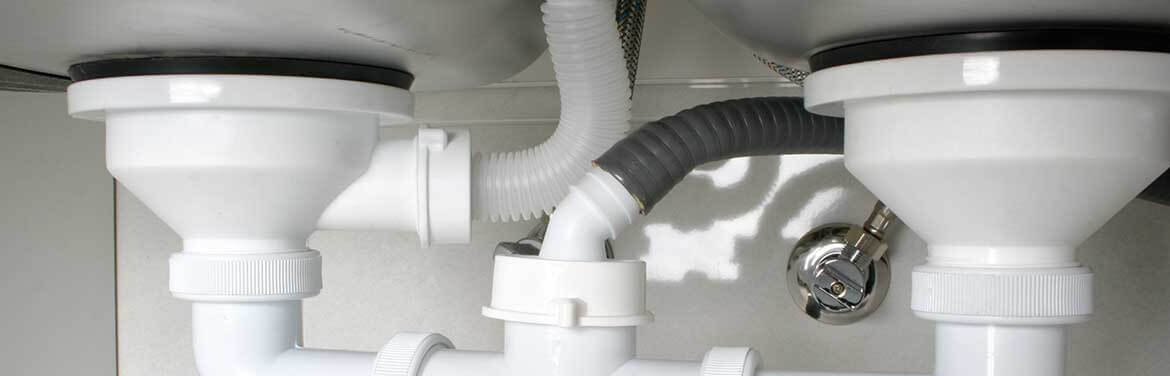 plumbing pipes under the sink